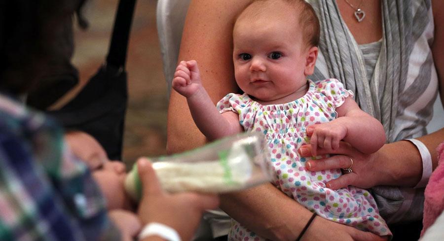 An eight-week-old baby is pictured.